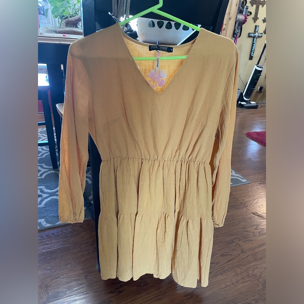 Yellow / tan colored dress